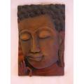 Beautiful carved wooden plaque of Buddha
