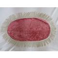 A pretty pink velvet oval cloth with tassels