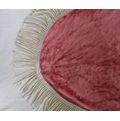 A pretty pink velvet oval cloth with tassels