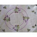 A vintage larger size expertly hand embroidered cloth with violets and hand crocheted border