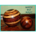 TWO WOODEN ORB DECORATIONS