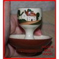 EGG CUP TORQUAY WARE  WATCOMBE  COTTAGE ON THE FRONT LAID TO DAY ON THE BACK FUN ITEM
