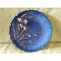 Genuine imperial  Imari plate. Blue background with stylized daffodils