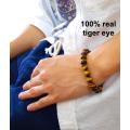 100% real golden tiger eye gemstone. Feng Shui healing benefits, 8mm bracelet. Good fortune.