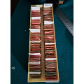 box of sorted and originally packed new vintage watch balance staffs most have 3 or more in them