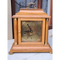 English oak mantle clock keeping time