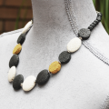 Atenea handmade White, Black & Mustard lava necklace on stainless steel