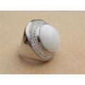 Spectacular heavy solid sterling silver topaz ring with white oval stone - weight 14.32 g.