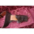 Cowboy belt and holster . Genuine leather
