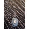 Sterling silver and gold pendant on chain