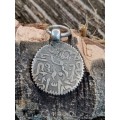 Ancient coin turned into pendant