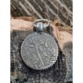 Ancient coin turned into pendant