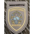 Correctional services tupper badges