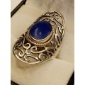 Sterling silver ladies ring with blue stone Size O.5