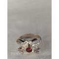 Sterling silver ladies ring with 1 Red stone and 4 White stones Size: M.5