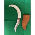 KNIFE WITH CARVED WARTHOG IVORY HANDLE