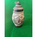 BEER STEIN WITH PAINTED MAN AND WOMAN IN TRADIONAL GERMAN CLOTHES