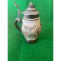 BEER STEIN WITH PAINTED MAN AND WOMAN IN TRADIONAL GERMAN CLOTHES
