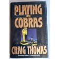 Playing with cobras by Craig Thomas