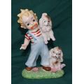 Hand Painted Vintage Porcelain Figurine of Boy with Dogs