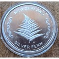 1 oz FINE SILVER - NEW ZEALAND FERN .999 SILVER COIN (CAPSULED)