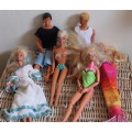 2 Ken dolls and 4 Barbies