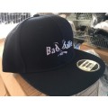 6 Panel Black SNAPBACK Cap-( Flat Peak) - With "Bad ballie" Embroidered