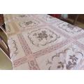 Pink cross stitch tablecloth with lace border