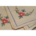 Four small embroidered napkins - cross stitch