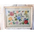 Charming tapestry of  flowers in vintage frame.