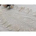 Large, oval, cream crochet doilie 70 x 35 cm