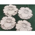 Four small embroidered linen doilies or coasters - 15cm