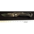 Ganzo Pocket knife G611 Black Rubber handle carbine and a whistle.