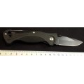 Ganzo Pocket knife G611 Black Rubber handle carbine and a whistle.