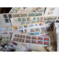BOX CONTAINING STAMPS ON PAPER AND MORE!