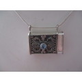 925 Sterling Silver and Bllue Topaz `Purse`/ Pendant on Strling Chain .