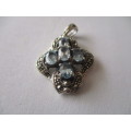 925- Sterling Silver and Blue Topaz Pendant.