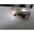 solid,  Sterling Silver  and Genuine Garnets Ring.