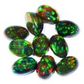 3.18 ct [10 pieces] 6.00 x 4.00 mm Oval Cab - Black Fire Opal price /piece