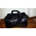 Brando Genuine Leather Black Duffel / Suitcase / Travel Bag on Wheels with telescopic handle !