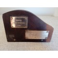Brass plaques on heavy wooden desk stand