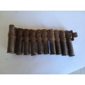 Very old section of ammo belt with empty casings possibly WW2 RAF browning machine gun .303