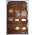 ANTIQUE LEATHER COIN POUCH WITH COINS.