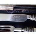 Hallmarked silver child's knife and fork set.