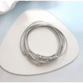 Silver Plastic Beads on Silver Stretchies -  Guitar String Coil Bracelets - Set of 7