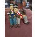 2 x Laurel and Hardy figurines, Reading and Sleeping