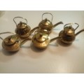 Collection of ornamental brass teapots