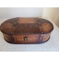 Small wooden suitcase, covered in leather