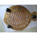 Brass trivet in the shape of a fish