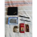 Assortment of tobacciana - lighters, cigarette holders and cigarette case